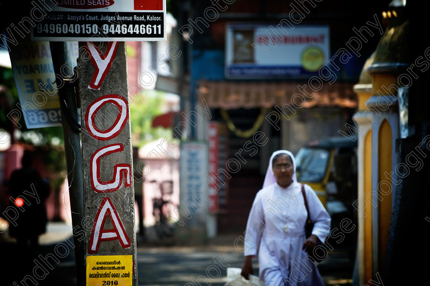 Yoga-Nun 
 Keywords: Catholic, Nun, religion, Cochin, Kochi, Kerala, India, yoga, sign