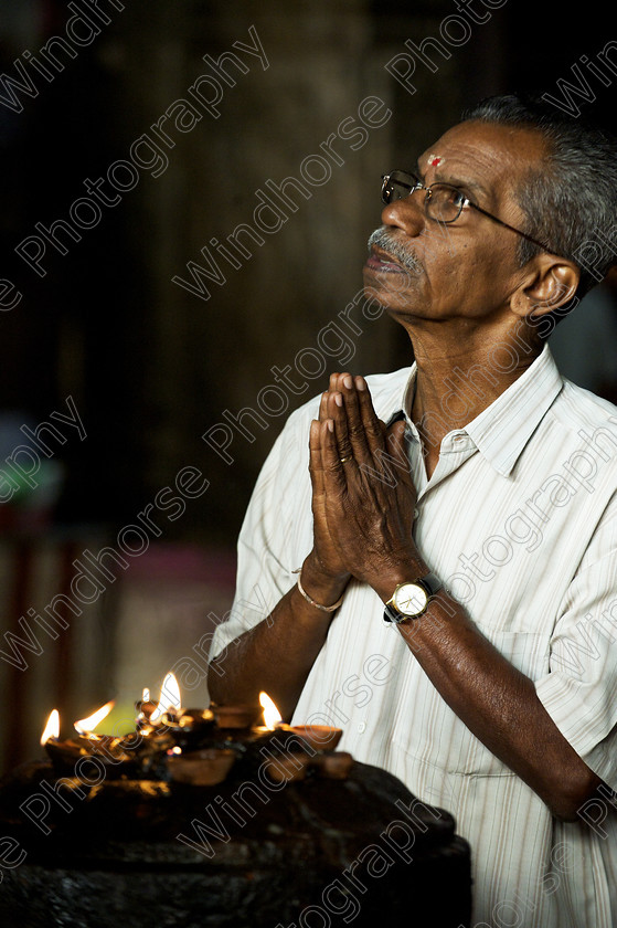 Prayers-Madurai 
 Praying at the Meenakshi Temple, Madurai, Tamil Nadu, India. 
 Keywords: Praying, Prayers, religious, religion, hindu, hinduism, Meenakshi, Temple, Tamil Nadu, India